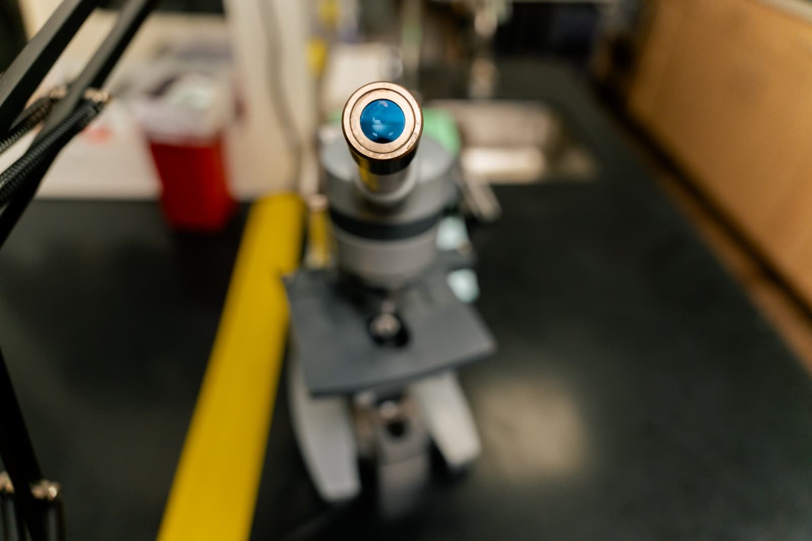 Microtome sectioning tissue into thin slices in the dermatopathology lab